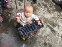 #4.A Boy And His Baby Carriage  From Yunnan