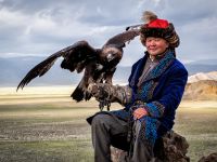 Eagle Hunter With His Eagle In Bayan Olgii, West Mongolia
