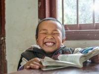 Chinese Boy With Big Smile At School,looking At Camera